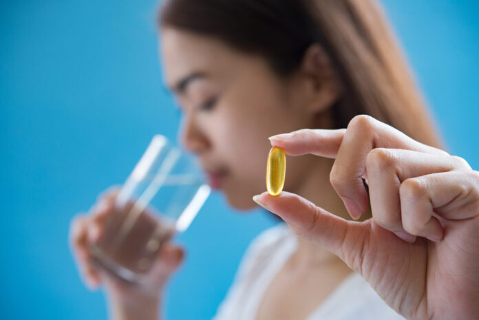 woman hand holding a pills take medicine according to the doctor's order